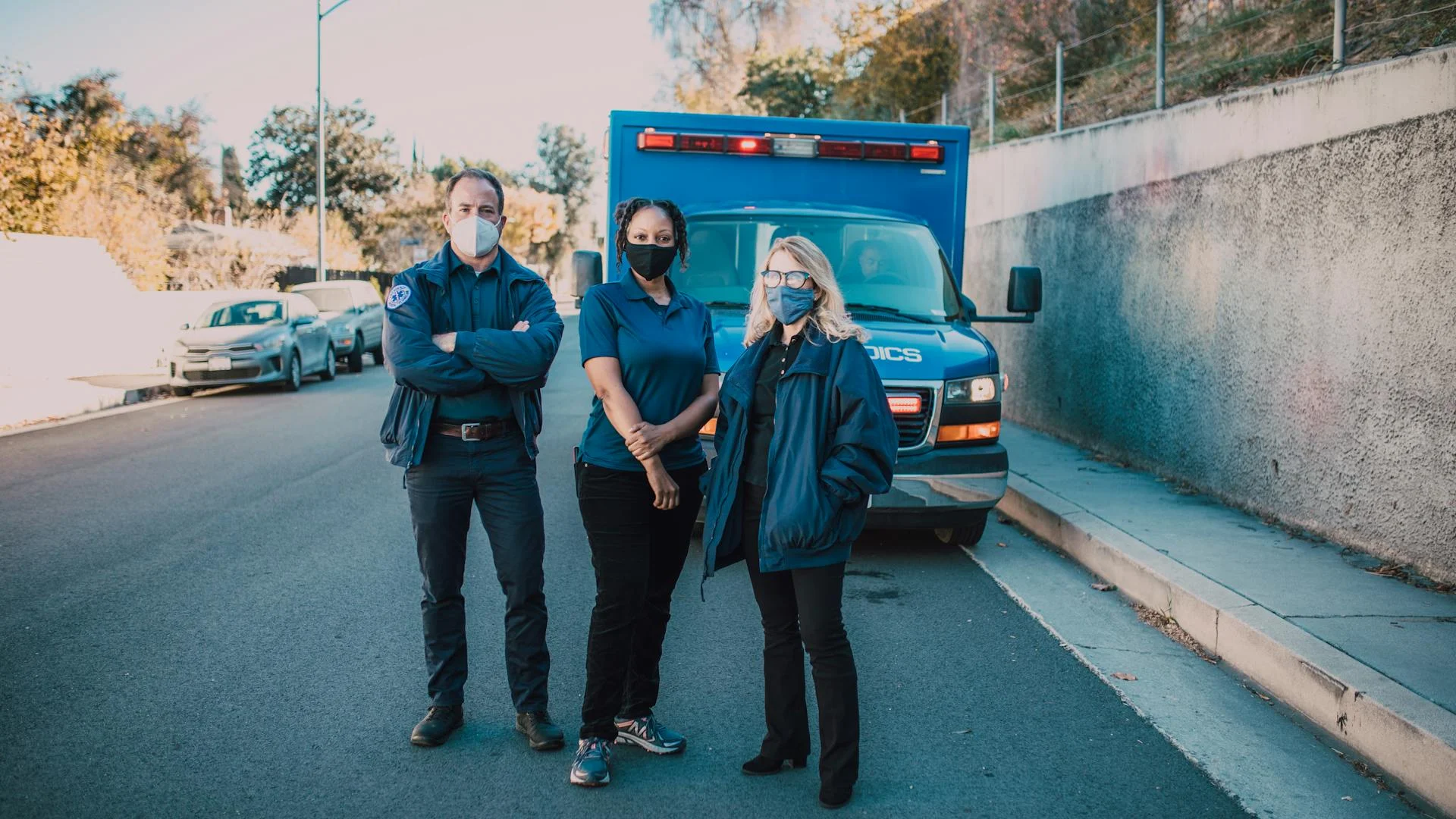 Workplace employees practicing AED training skills for emergency preparedness